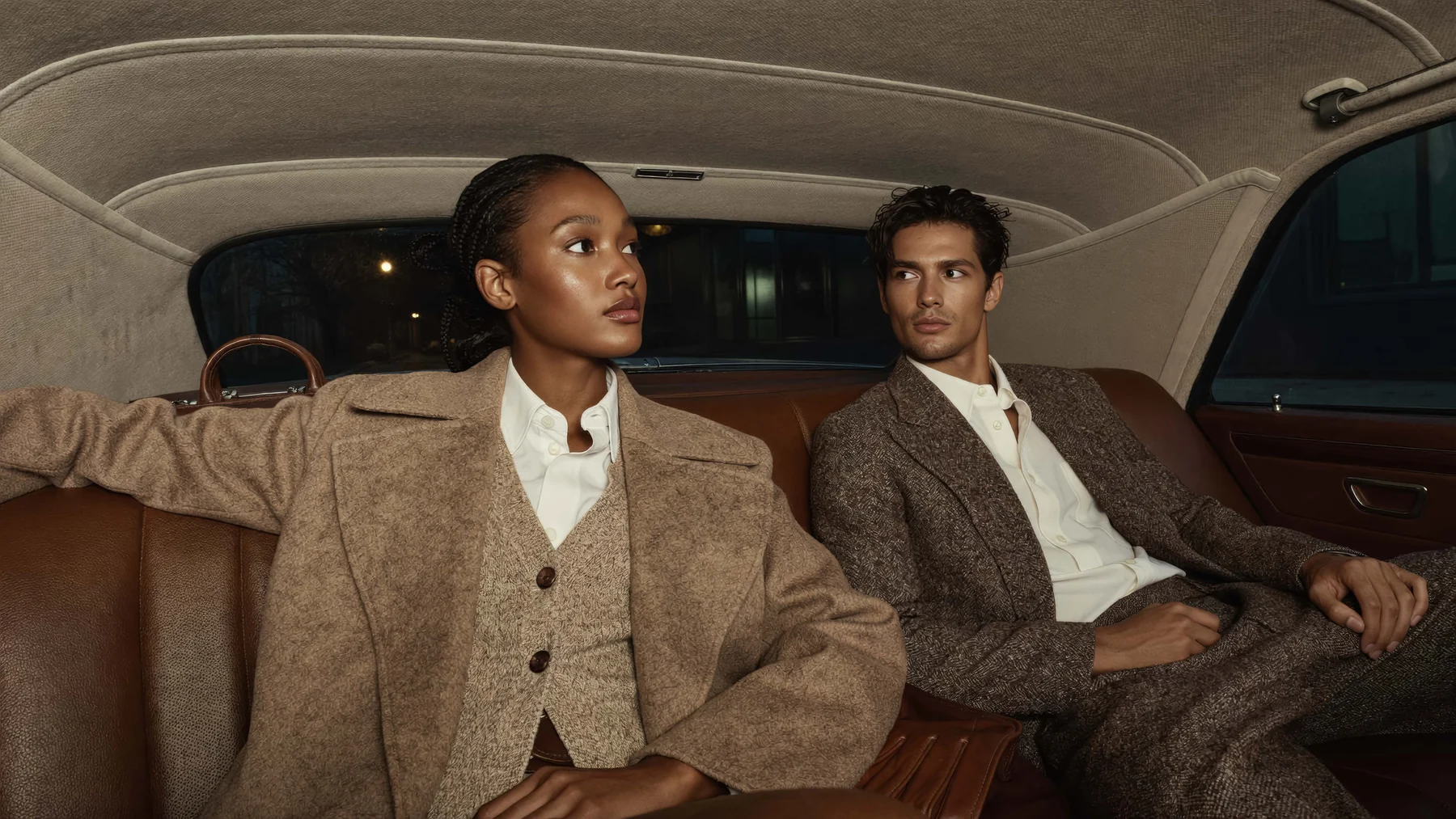 Tailoring couple inside a vintage car